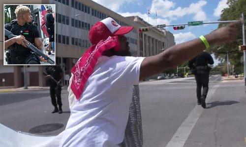 'Take your a** home!' Heavily-armed black rights groups march through Austin chanting anti-illegal migrant slogans, demands Biden 'close the border' and calls for 'reparations to be paid NOW'