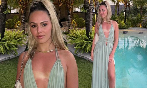 Mia Fevola shows off her tan lines as she poses in a revealing green goddess frock after sunning herself during luxury holiday in Bali