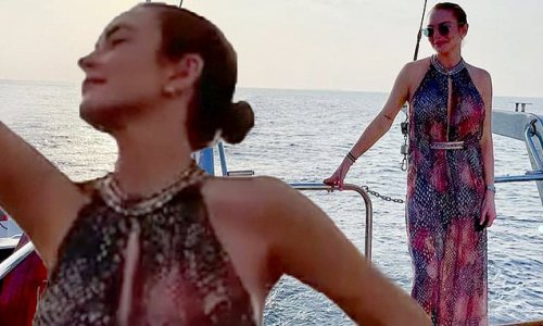 Lindsay Lohan looks blissful at sunset on a yacht in the Maldives