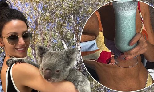 Michelle Keegan shows off her chiselled abs in patterned bikini and poses with koala bear as she goes on solo trip around Australia