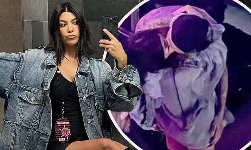 'Fell in love': Kourtney Kardashian shows off her legs in selfies taken in a MEN'S bathroom before kissing Travis Barker during concert in Germany