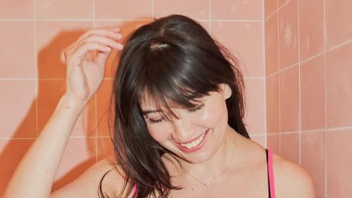 Daisy Lowe shows off her incredible figure in bright pink lace lingerie for Valentine's Day as she...