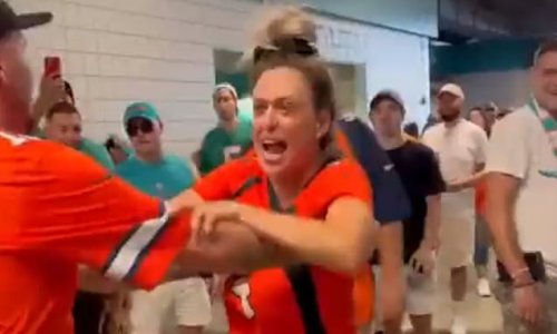 Footage of Broncos fan trying to fight Dolphins rivals in concourse emerges... as violence inside NFL stadiums around US continues to rise