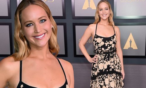 Jennifer Lawrence is a sun-kissed stunner in flirty black tulle floral dress as she owns the red carpet at the 13th annual Governors Awards in LA