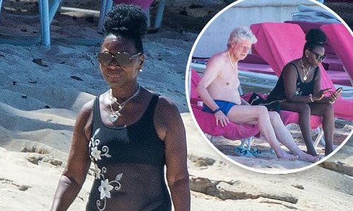 Today we'll be sunbathing through the round window! Baroness Floella Benjamin, 72, relaxes in a black mesh swimsuit as former Play School presenter visits the beach with husband Keith Taylor in Barbados