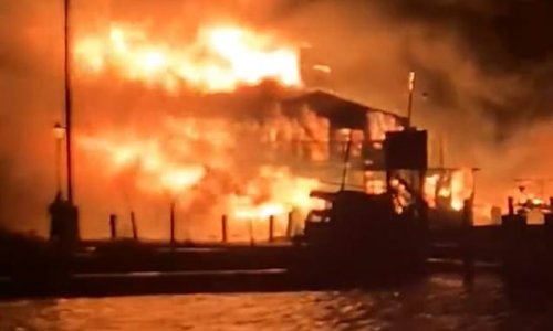 BREAKING NEWS: 4-alarm fire consumes a 'block's worth of commercial and residential buildings' and several boats at Seaport Marine just outside downtown Mystic, Connecticut