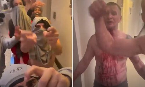 Masked prisoners run amok and pose with bloody inmates 'at HMP Wandsworth' while 'refusing to re-enter their cells during 23-hour lockdown'