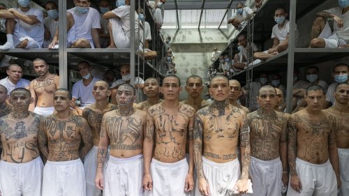 Hidden messages in the tattoos that adorn gang member inmates of El Salvador's 'hellhole' mega jail