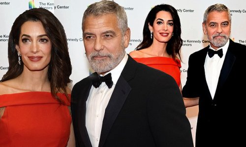 George Clooney looks handsome alongside his wife Amal who is ravishing in red off-the-shoulder gown as they attend the Kennedy Center Honors ceremony in Washington, D.C.