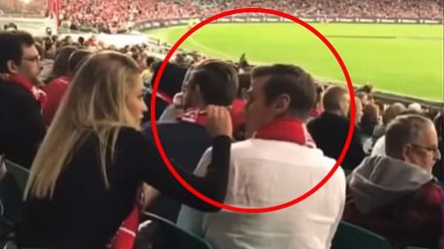 Sydney Swans: Footy fans slam AFL team after one of their supporters was caught getting a beauty treatment in the middle of a game - but all is not as it seems