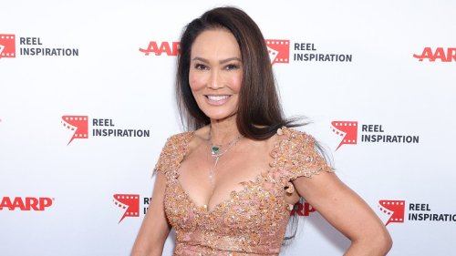 Wayne's World star Tia Carrere, 57, puts on a busty display in a sparkling minidress as she leads...