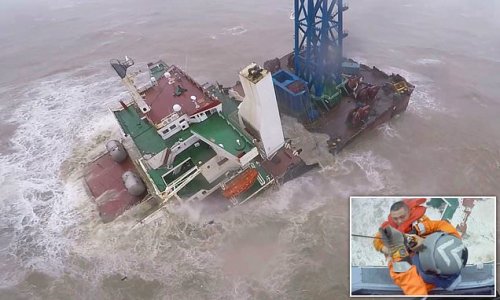 Tragedy at sea in Typhoon Chaba: Dozens of crew are missing after massive ship broke in half and sunk off Hong Kong as dramatic video shows one being winched off just before vessel vanished beneath the waves