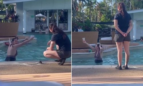 Wild moment a foul-mouthed woman holding a cocktail screams at resort staff while refusing to get out of the pool: 'I'm a 45-year-old woman on holiday - you're joking right?'