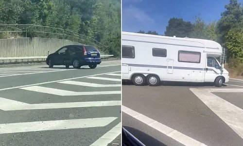Shocking moment motorists perform u-turns on busy motorway and drive the WRONG way up slip road to avoid traffic jam