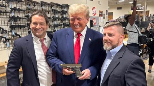 Trump goes GUN shopping with Marjorie Taylor Greene: Former president poses with a $829.99 9MM GLOCK with his face on the grip in armory tour