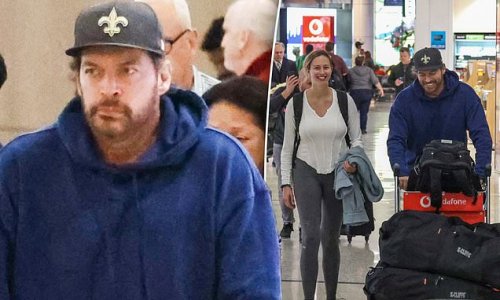 New Australian Idol judge Harry Connick Jr dresses down in a blue hoodie as he flies into Sydney with his daughter Georgia to film the new season of the reality series