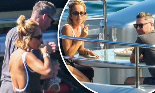 Back on? Michael Clarke and swimsuit-clad Pip Edwards are spotted looking cosy over a couple of champagnes amid reconciliation rumors as they join Anthony Bell on the back deck of his luxury superyacht