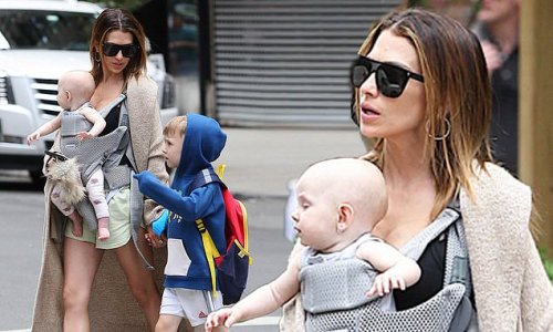 Hilaria Baldwin keeps her cool in lime green shorts and low-cut top as she takes her children for a stroll in NYC