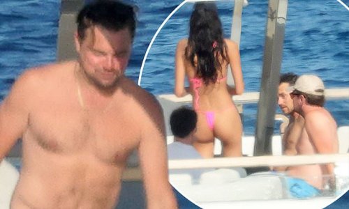 Leonardo DiCaprio, 48, showcases his buff physique in swimming trunks as he joins bikini-clad babe on a superyacht in sun-soaked Sardinia