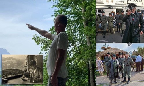 Leader of group which sparked fury for wearing SS uniforms at 1940s festival is pictured performing Nazi salute near Hitler's 'Eagle's Nest' mountain retreat in Bavaria