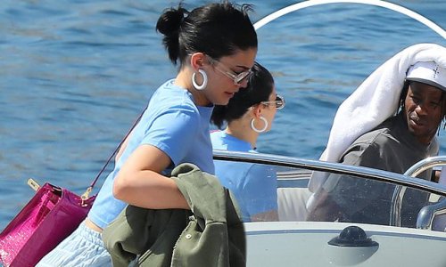 Kylie Jenner reveals her honed curves in ruched trousers as she sails into Monaco with Travis Scott