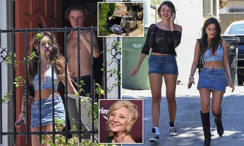 EXCLUSIVE: Anne Heche's son, 20, is comforted by two female friends at his LA home as his mother recovers in hospital from horrific burns in fiery car crash