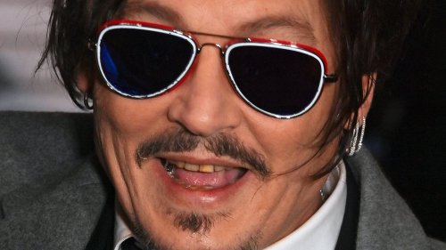 Fantastic fangs and where to whiten them! Johnny Depp bares his yellowing teeth at Jeanne Du Barry...