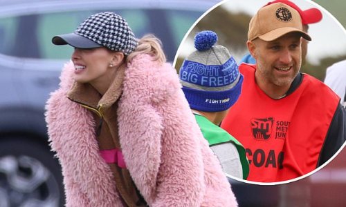 Bec Judd makes a bold fashion statement as she cheers on from the sidelines as husband Chris coaches son Oscar's weekend footy game