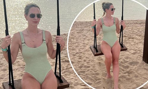England star Conor Coady's wife Amie shows off her svelte physique in a mint green swimsuit as she heads to the beach during the World Cup in Qatar