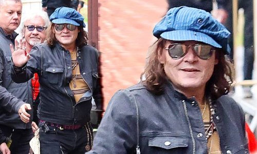 Johnny Depp, 59, looks ready to party as he holds a red plastic cup ...