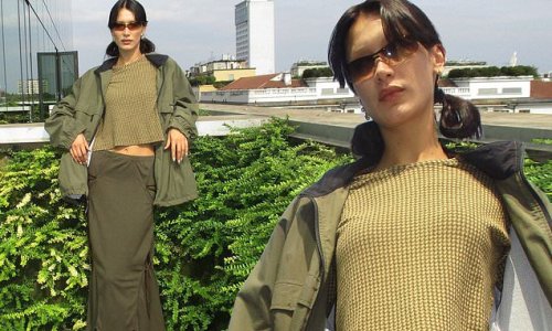 Bella Hadid flashes her tummy in a green top before reposting a message about women being 'murdered for the right to be' in Iran