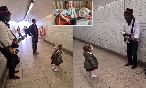 What a Wonderful World! Moment girl, 2, is mesmerised by a London busker serenading her with Louis Armstrong classic