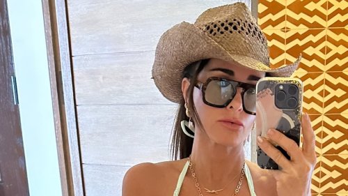 Kyle Richards sizzles in busty bikini selfie and cowboy hat... after leaving flirty comment on...