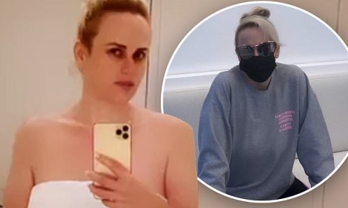 Rebel Wilson strips down to just a towel as she gets a facial