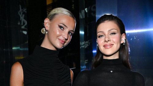 Brooklyn Beckham's wife Nicola Peltz flashes her bra in a sheer black top and skirt as she joins Romeo's stylish girlfriend Mia Regan at YSL party during Paris Fashion Week