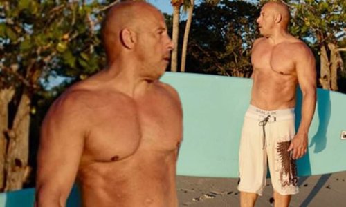 Vin Diesel, 52, displays his hunky shirtless physique as he poses up on the beach