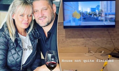 Brendan and Alex Fevola watch TV in empty lounge room