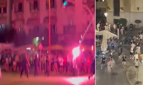 Football thugs hurl chairs at each other in ugly scenes before Europa League final tonight - as tens of thousands of Rangers and Frankfurt fans spend day soaking up atmosphere in Seville