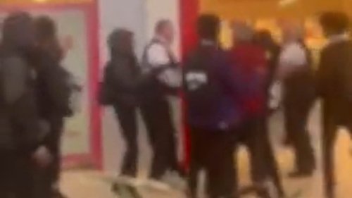 Moment 300 children storm shopping centre and clash with security