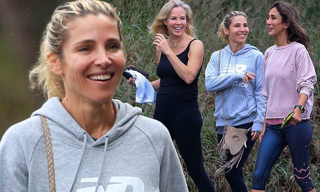 Makeup-free Elsa Pataky, 43, keeps it casual in a grey hoodie and leggings as she laughs with her friends on a gentle stroll in Byron Bay