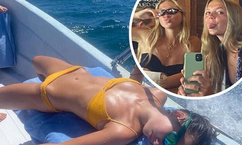 Lila Moss flashes her sensational figure in a skimpy yellow bikini while soaking up the sun with friends in Mexico