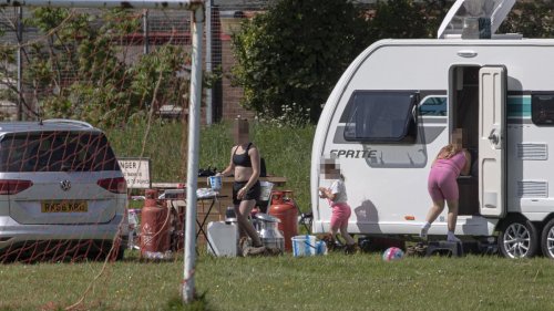 Travellers invade school playing fields forcing furious head teacher to relocate lessons and admit it will be difficult to evict them
