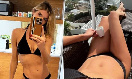 Model and TV presenter Laura Csortan, 45, shows off her age-defying body in a skimpy bikini as she soaks up the sun on her balcony