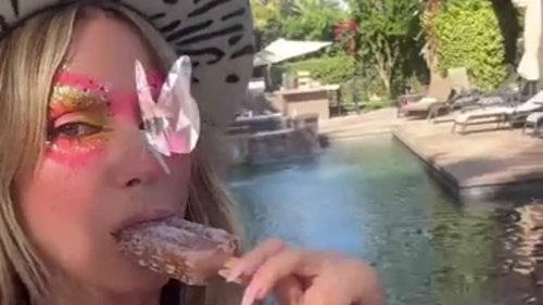 Heidi Klum, 50, shows off dramatic face makeup for Coachella while daughter Leni Klum, 19, kisses...