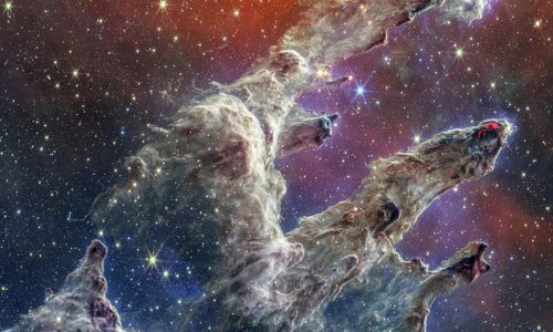 Cosmic claw! NASA's James Webb Telescope unveils a STUNNING new view of the Pillars of Creation that resembles a ghostly hand reaching out into space