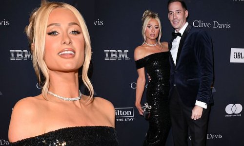 New mom Paris Hilton is the epitome of glamour in dazzling black sequin gown beside husband Carter Reum as they make first red carpet appearance since birth of son via surrogate