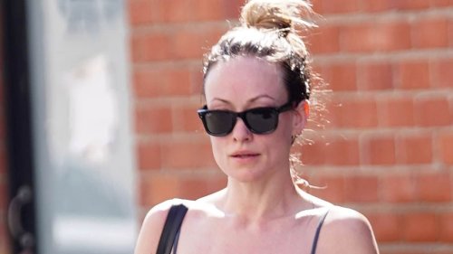 Olivia Wilde shows off her incredible figure in a skintight sports top and leggings as she leaves...