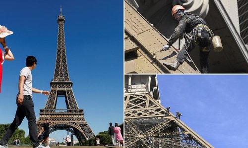 Cover-up continues on the awful Eiffel: Workers put a fresh lick of paint on Paris's iconic tower after leaked report revealed it is 'riddled with rust and drastically needs repair'