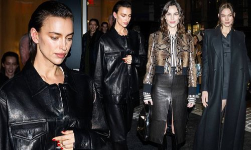 Irina Shayk looks typically stylish in a black leather coat as she