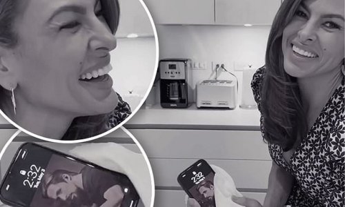 Eva Mendes reveals her longtime partner Ryan Gosling is the wallpaper on her cell phone as she shares charming video taken in their kitchen